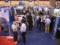 151 Exhibit Hall  Attendees networking on show floor
